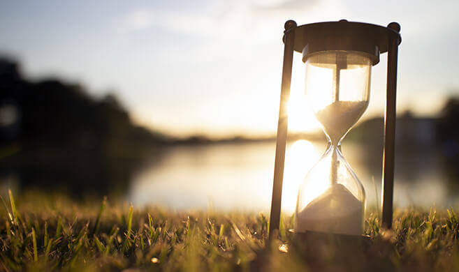 hourglass on the grass